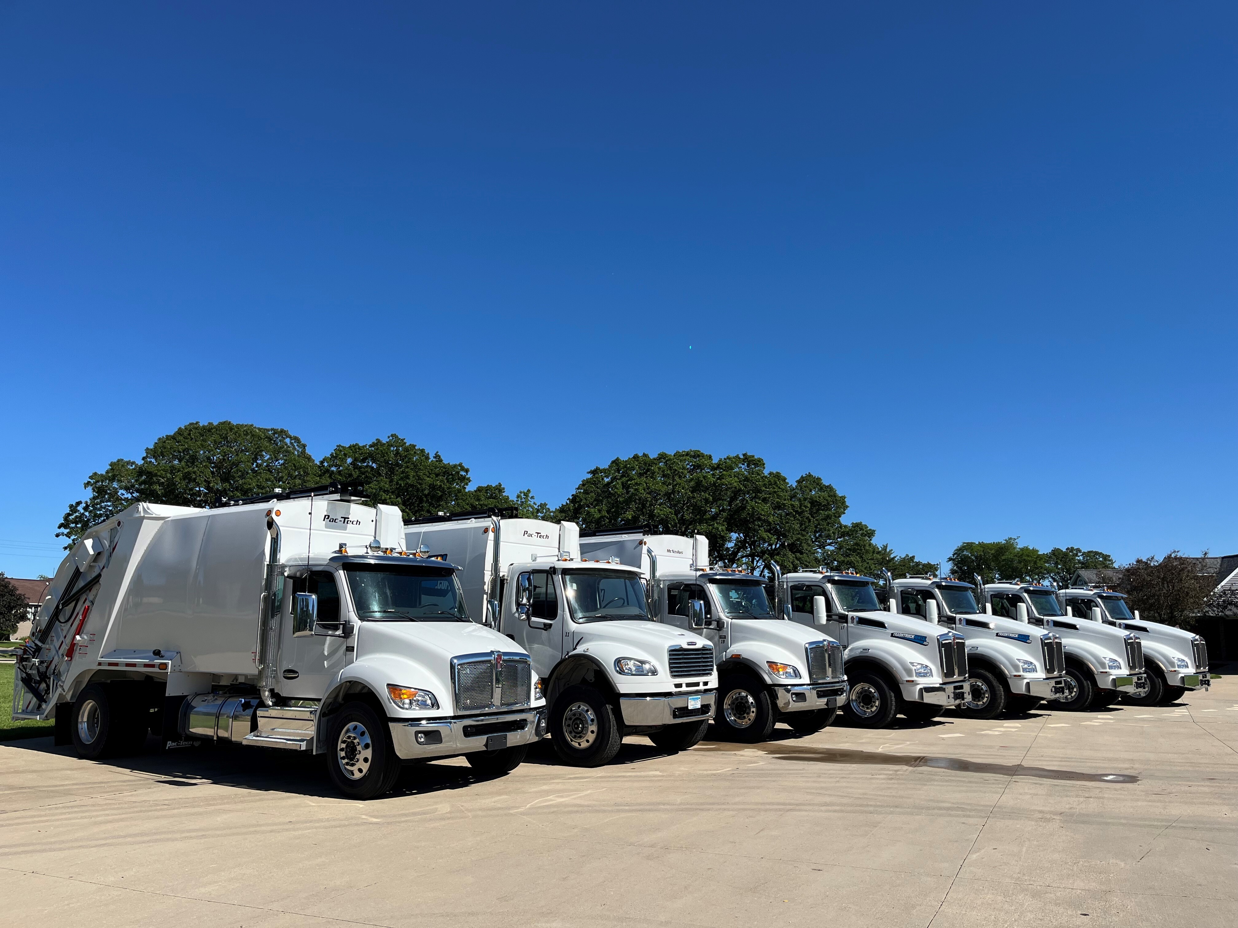 Modern garbage truck fleet operations at Trash Truck Rental facility#1.9