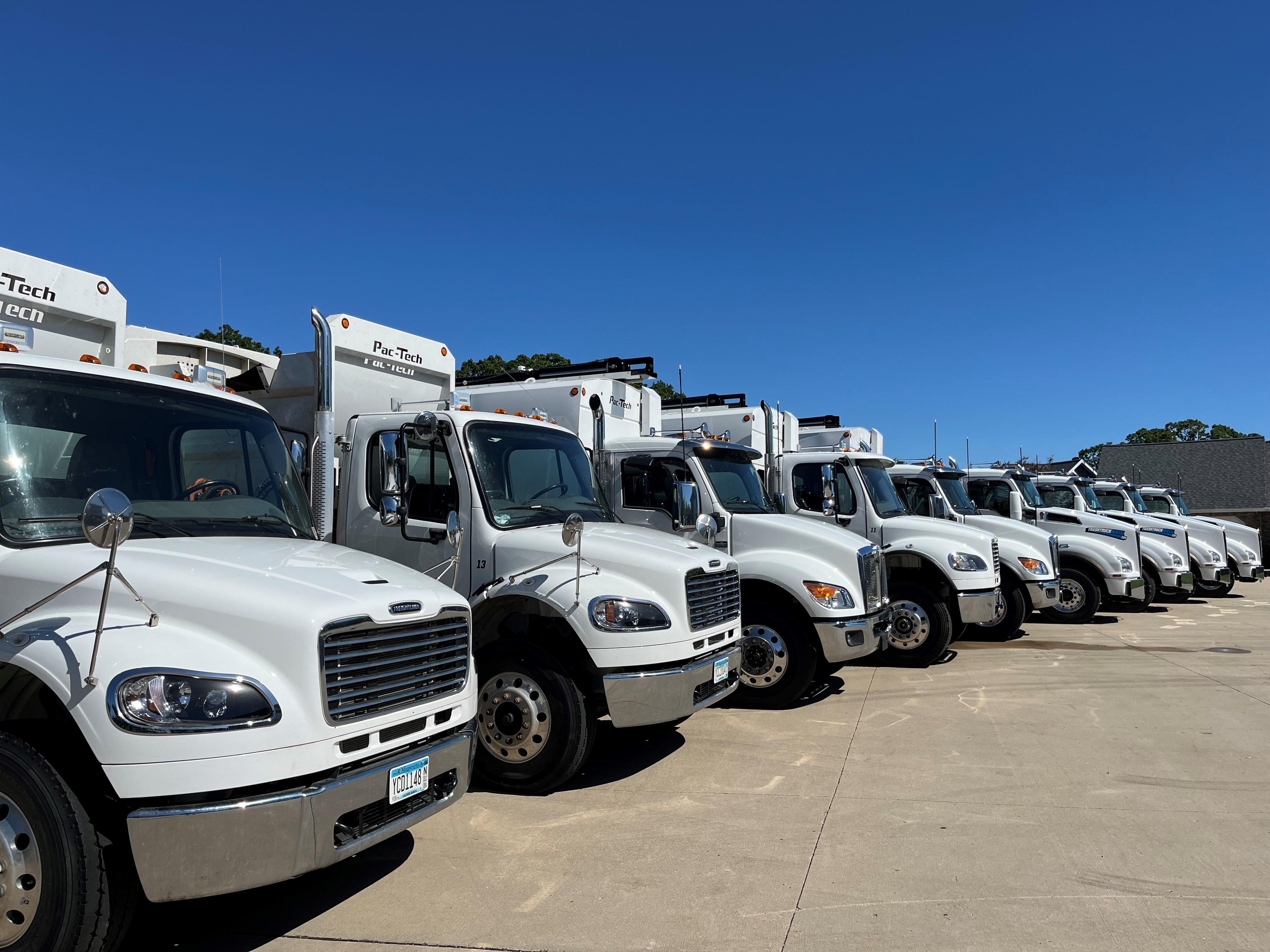 Modern waste management truck fleet with latest technology features#1.9
